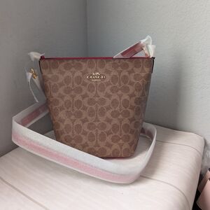 NWT Coach CCL33 Logan Duffle Bag Crossbody In Signature Canvas IM/Tan/Carnation